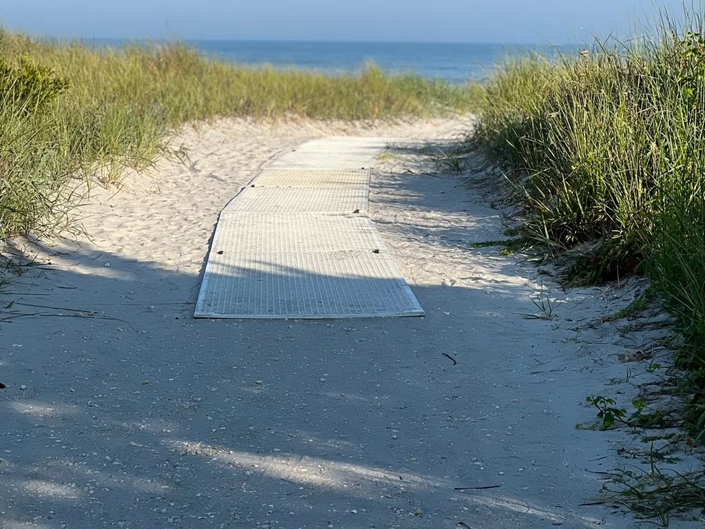 Beach entrance at 7th St, less than 2 min walk with lifeguards