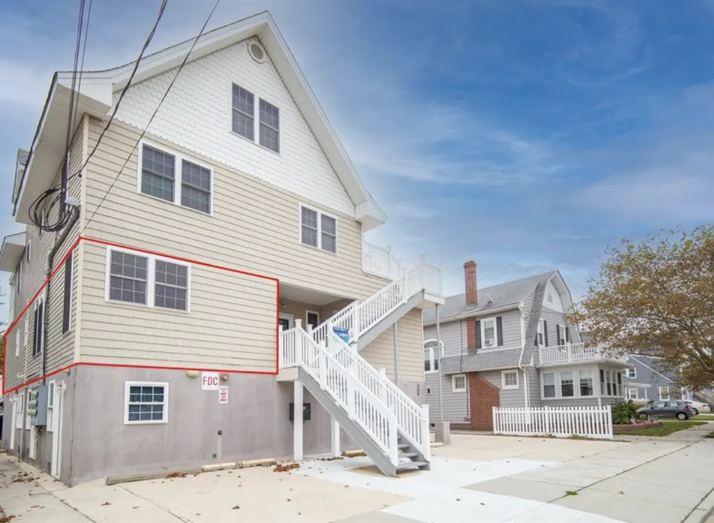 Unit 101 outlined in red, and our 2 parking spots to the left of the stairs