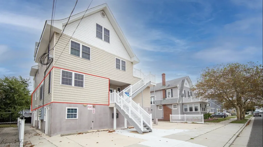 Unit 101 outlined in red, and our 2 parking spots to the left of the stairs