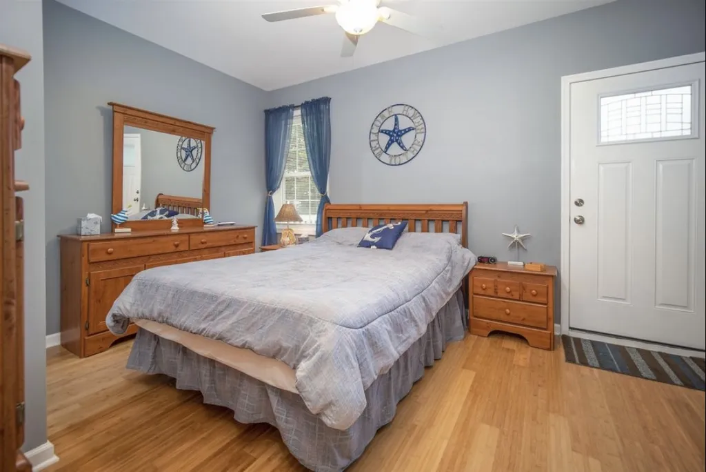Master bedroom with door leading to the back deck and pool