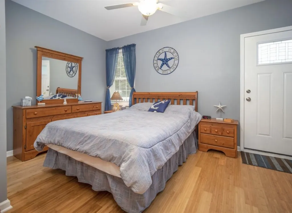 Master bedroom with door leading to the back deck and pool