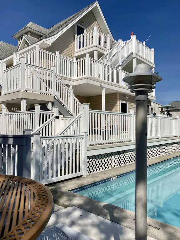 Two deck chair areas at each end of the pool