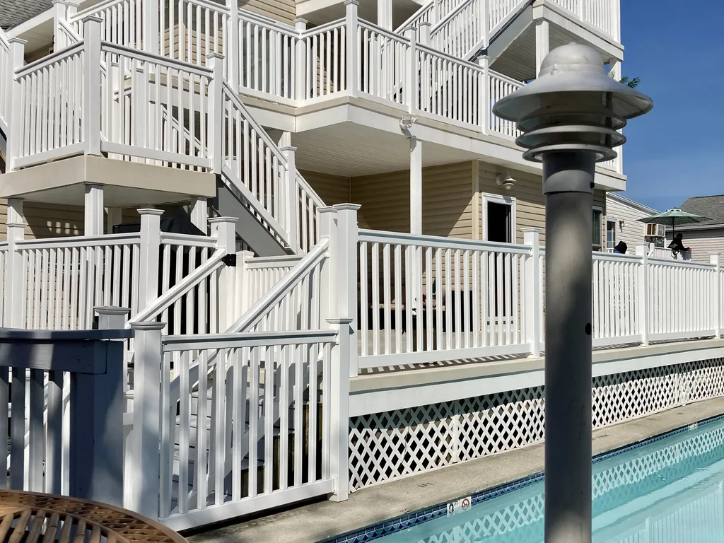 Two deck chair areas at each end of the pool