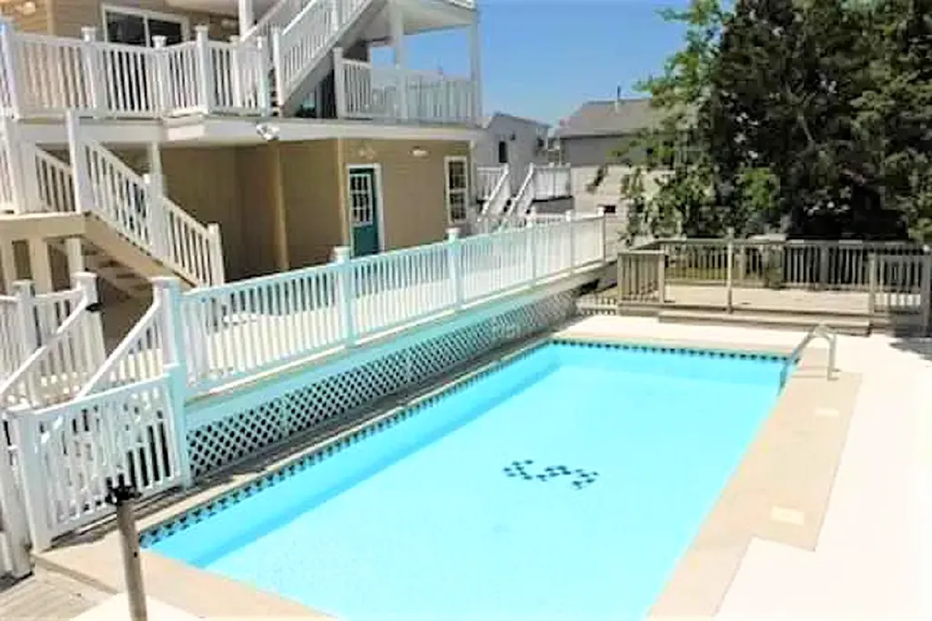 pool with chair/umbrellas