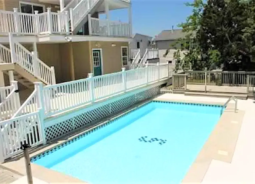 pool with chair/umbrellas