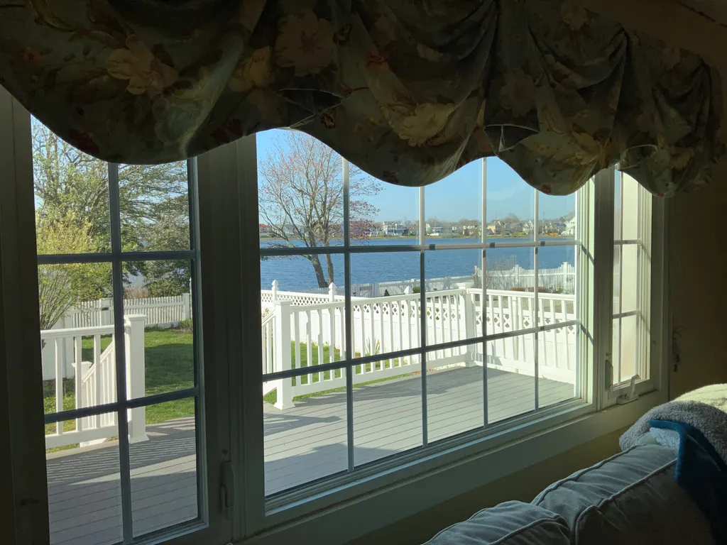 Living room and deck with lake views 