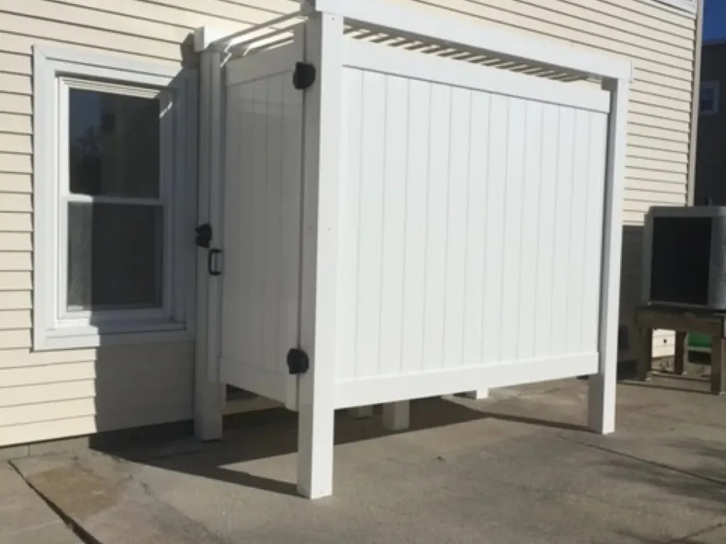 Outdoor shower behind garage