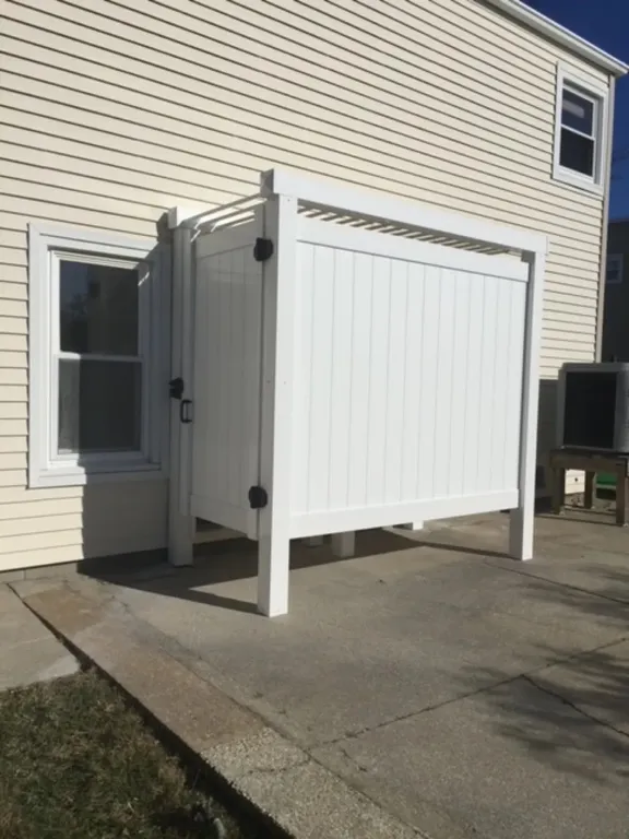 Outdoor shower behind garage