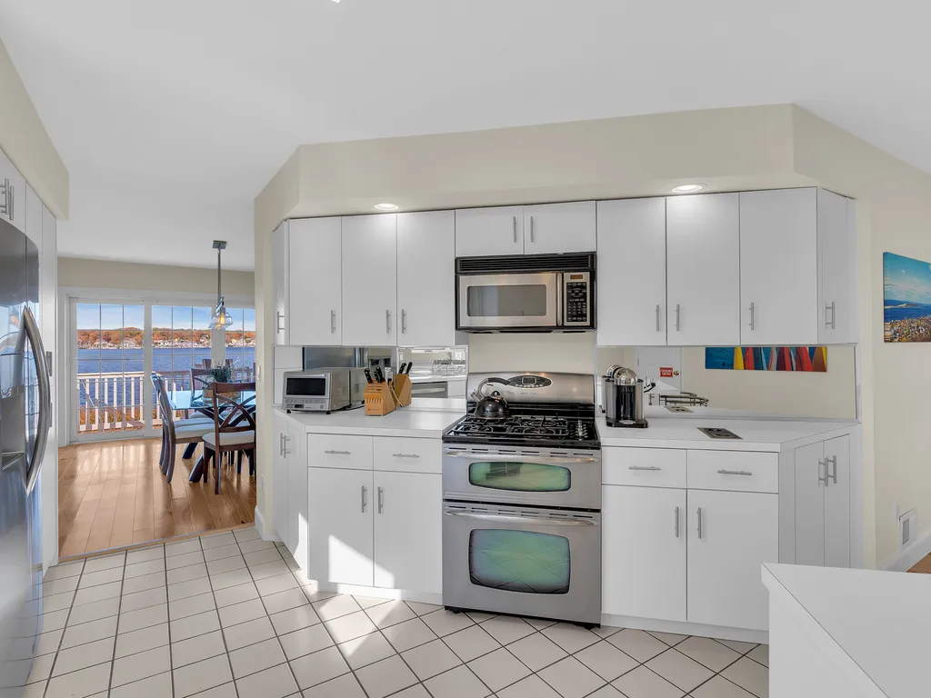 Full kitchen with cookware and dinnerware