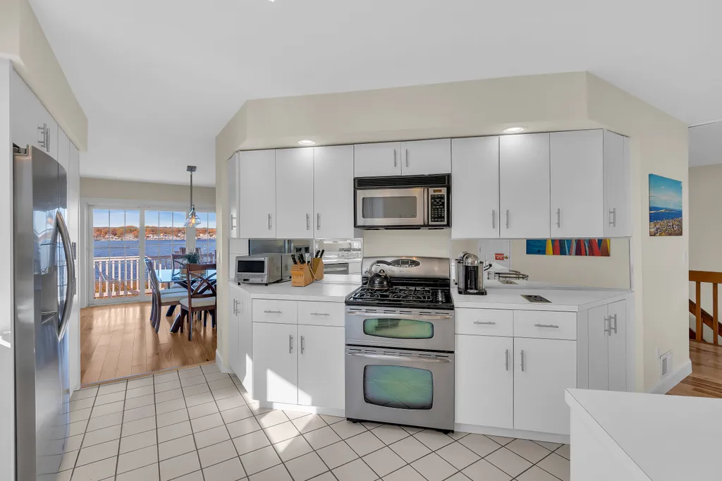 Full kitchen with cookware and dinnerware