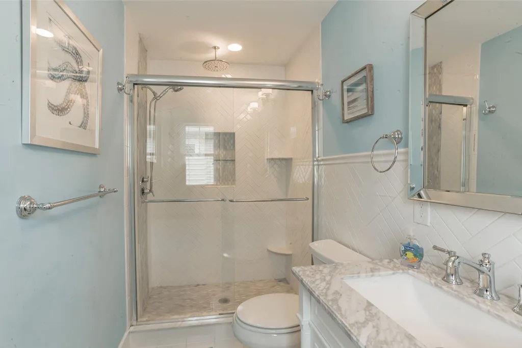Master bedroom 1 ensuite w/ marble top  double sink with rain shower
