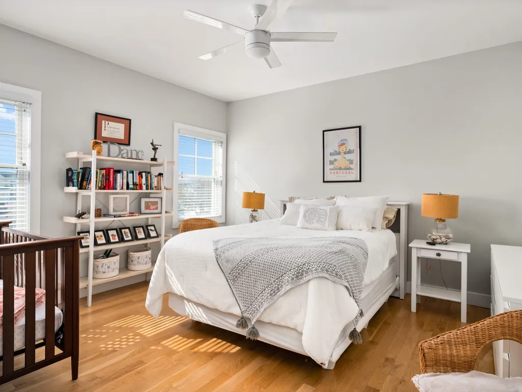 Queen bedroom with a crib