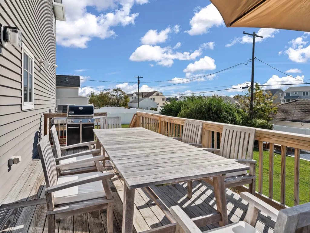 Back porch off dining room with a natural gas grill 