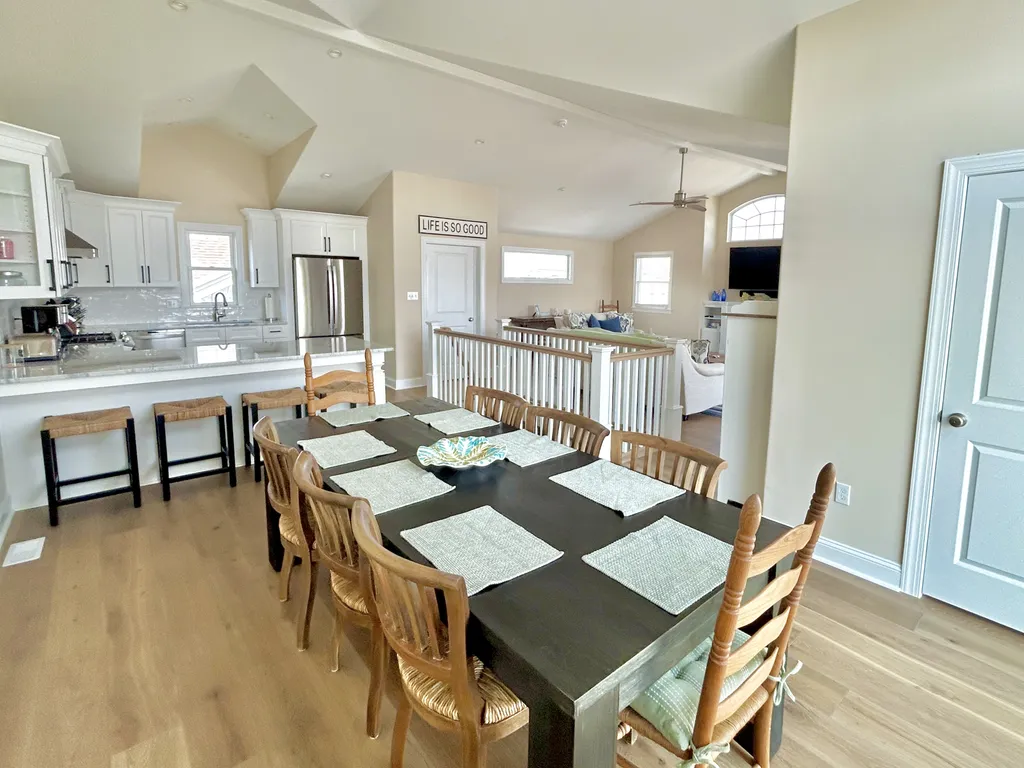 3rd floor dining space to kitchen and living room space. .5 BA to the right in the picture.