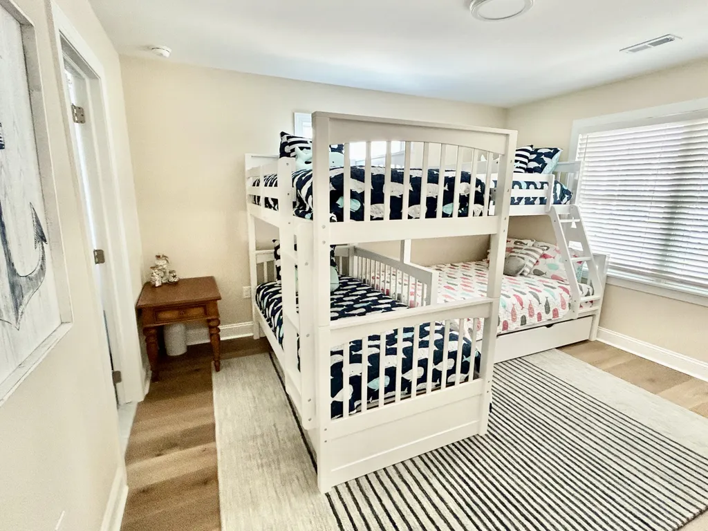6th BD bunk room with twin over twin, twin over full over full trundle. Extra pillows and bedding provided, shared jack an jill BA