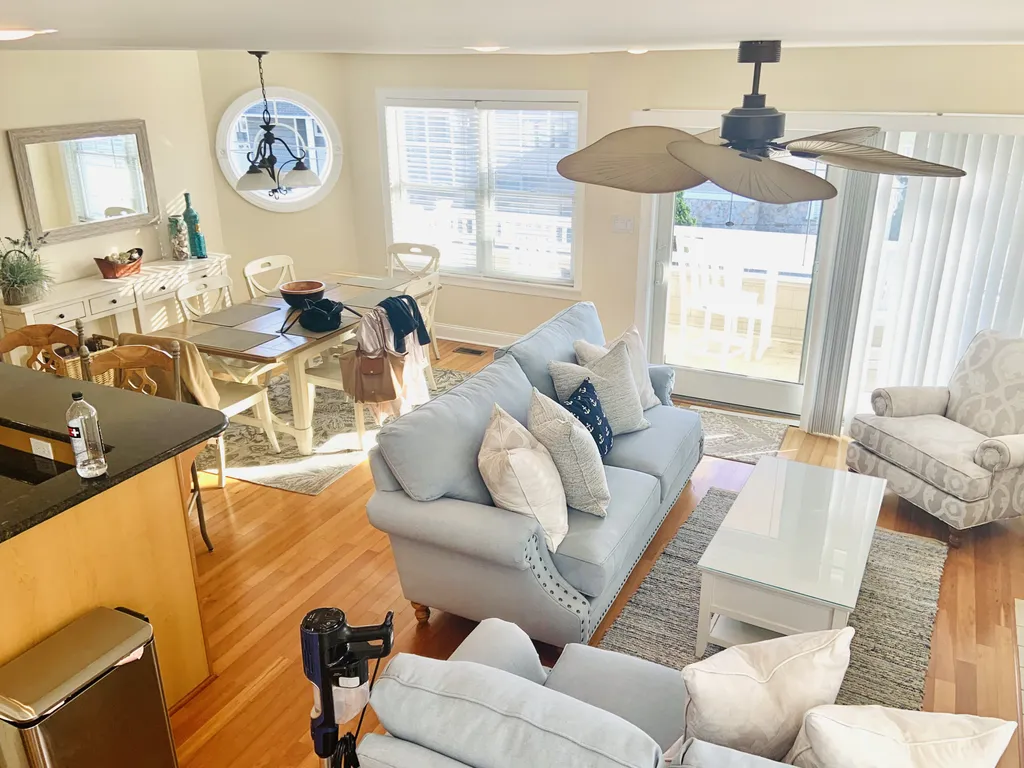 Main living space, dining room and deck, view taken from stairs.