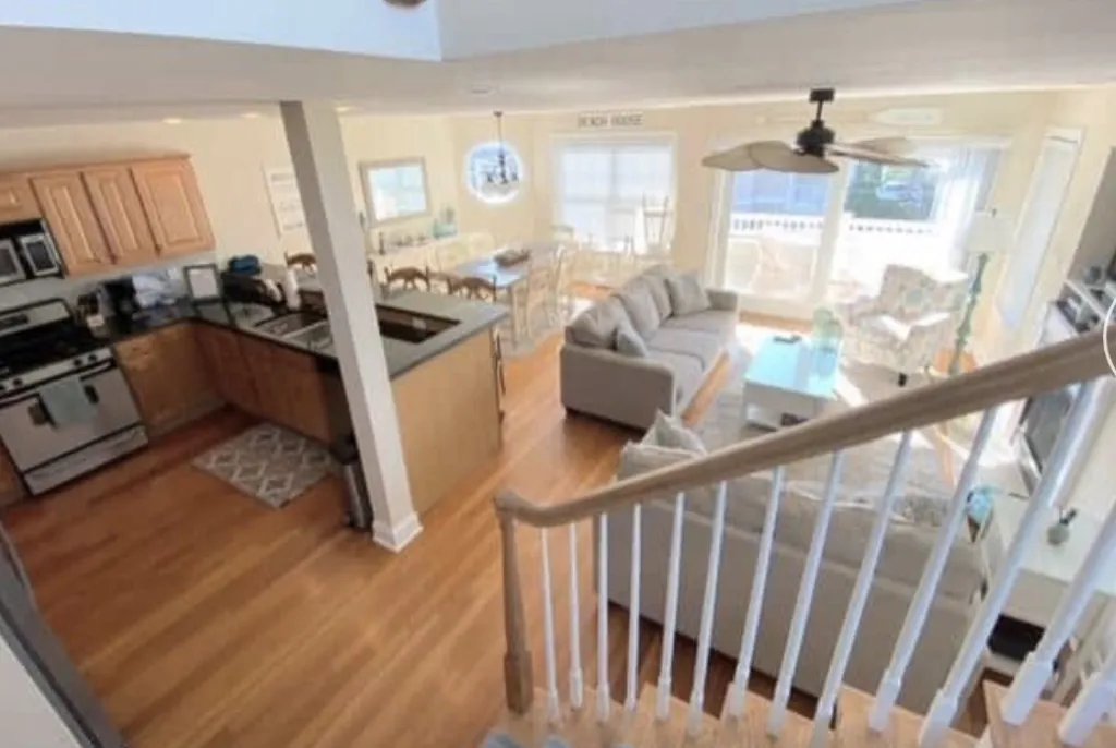 A different angle of living space with kitchen.