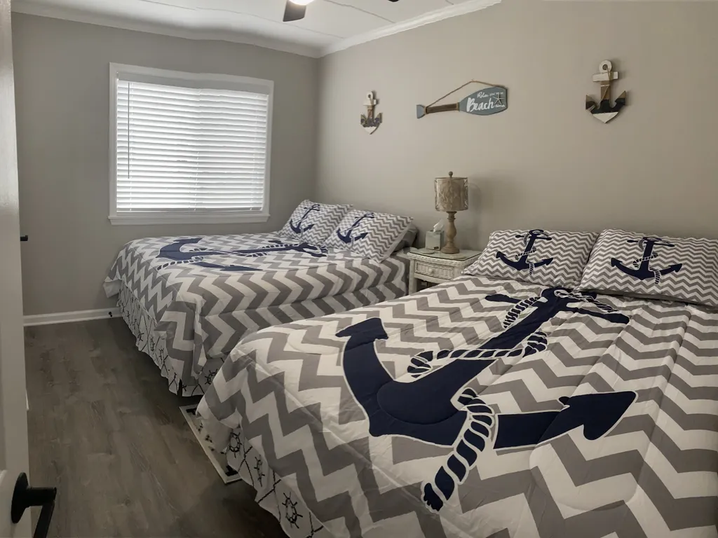 Bedroom with 2 Brand New Queens Beds