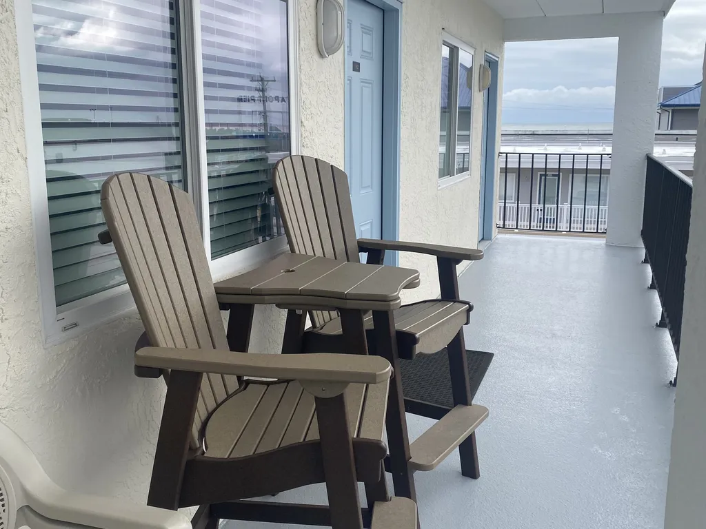 Outside unit Patio Area W/Adirondack Patio Chairs.