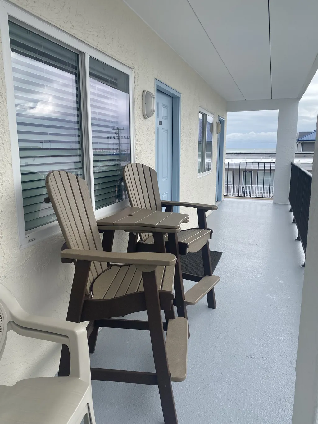 Outside unit Patio Area W/Adirondack Patio Chairs.