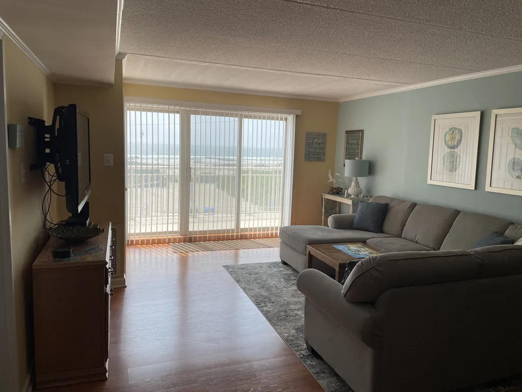 Living Area with sliding door to pool deck