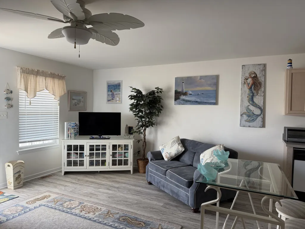 Open LR with queen sleeper sofa and love seat