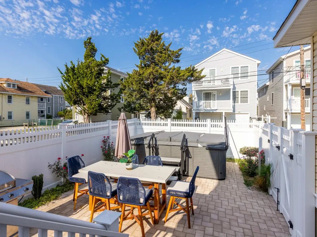 Fenced in back yard with spa hot tub