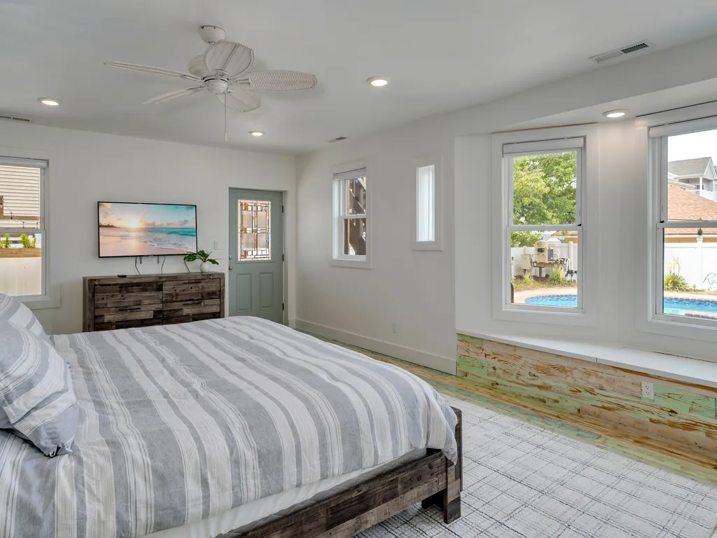 First floor master bedroom with view to pool