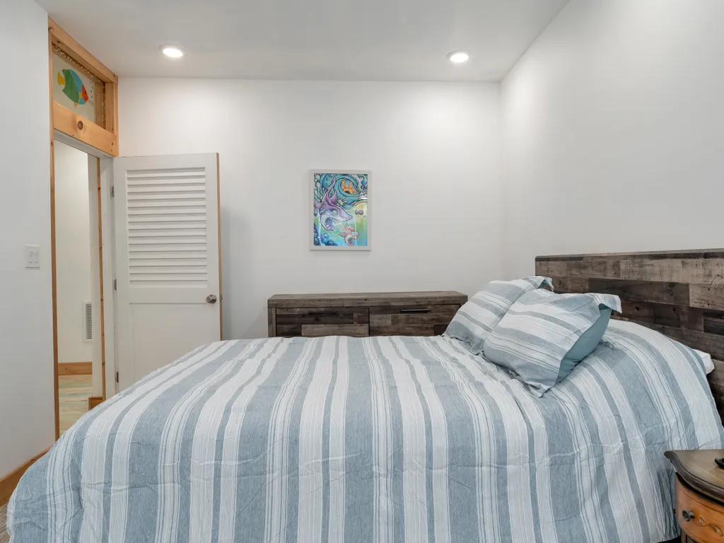 Alternate view of queen bedroom with ensuite bathroom