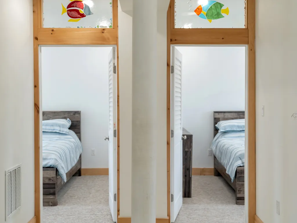 side by side queen bedrooms with ensuite bathrooms on second floor