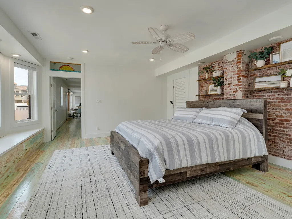 View of exit out of first floor master into hallway leading to living area and kitchen