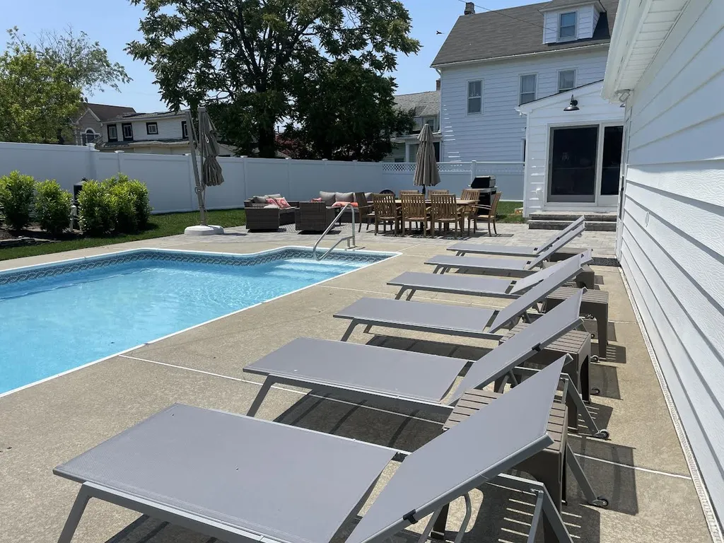 backyard pool, dining and lounge areas