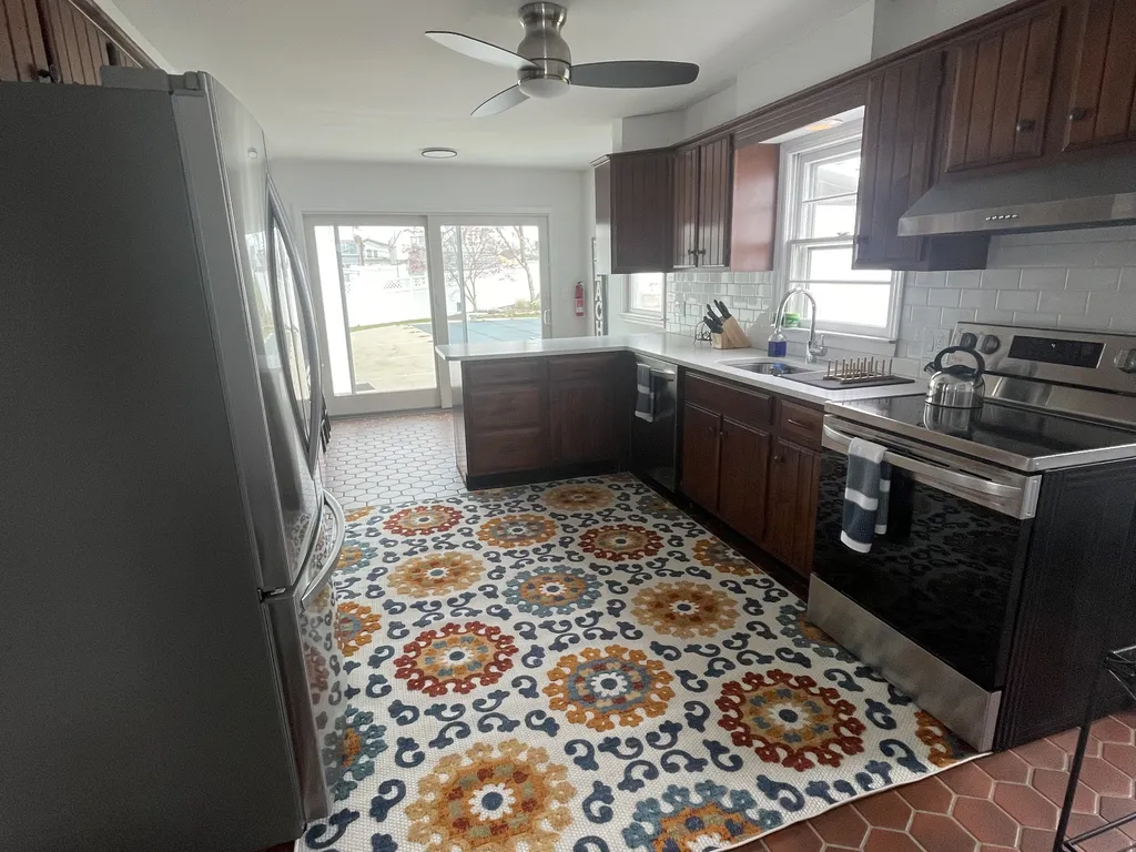 kitchen with new stainless steel appliances, electric stove