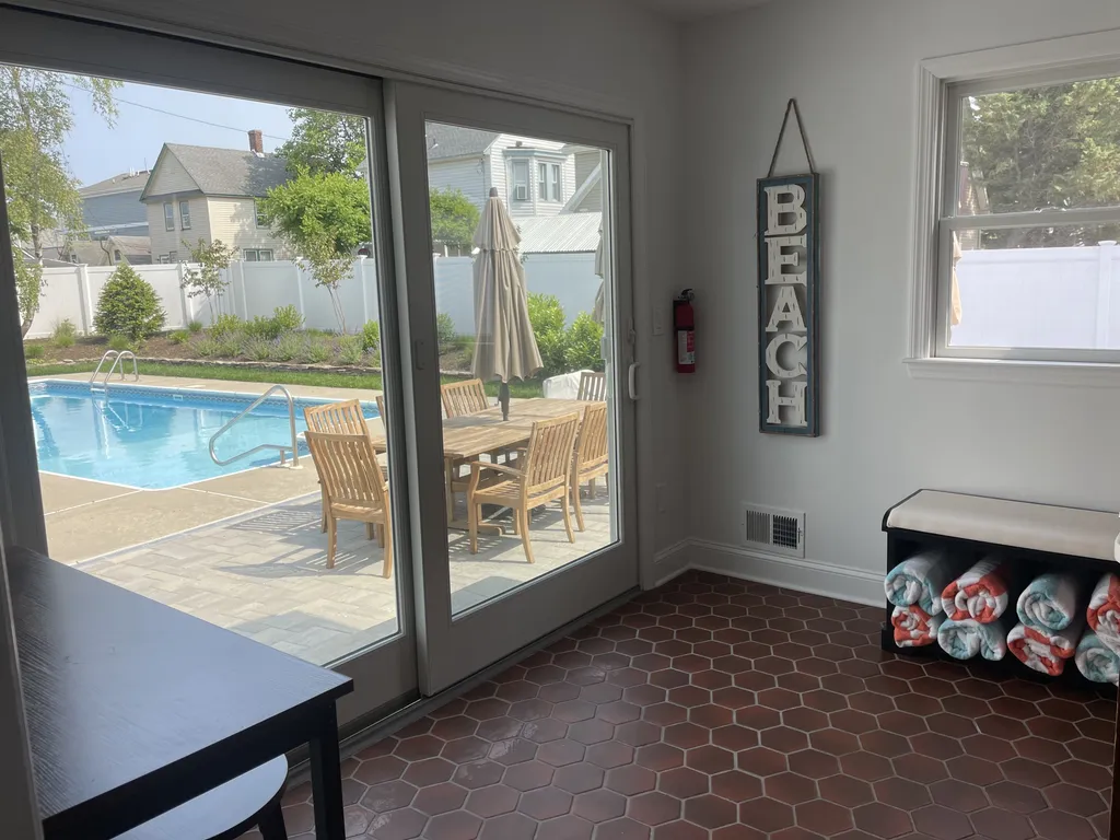 sliding glass door to backyard pool area