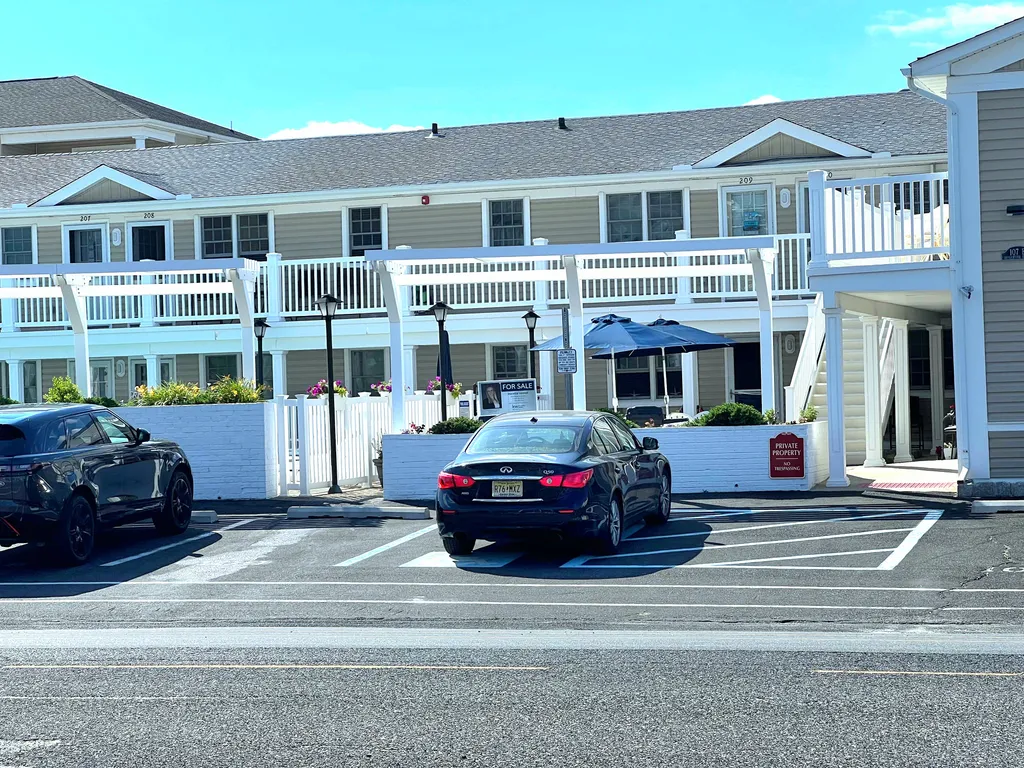 One assigned parking spot and one guest spot