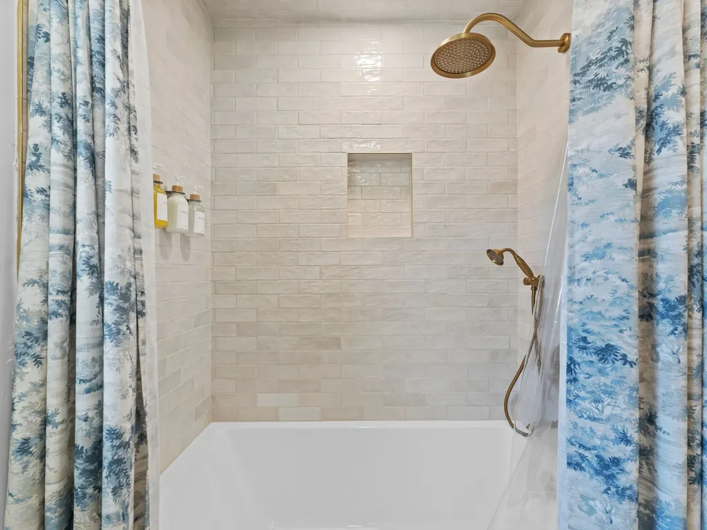 Full bathroom with bathtub and rain shower