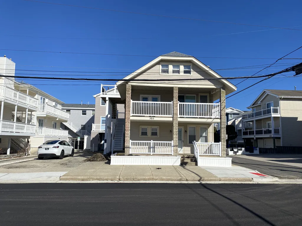 Photo of home, gray deck on left accesses our home.