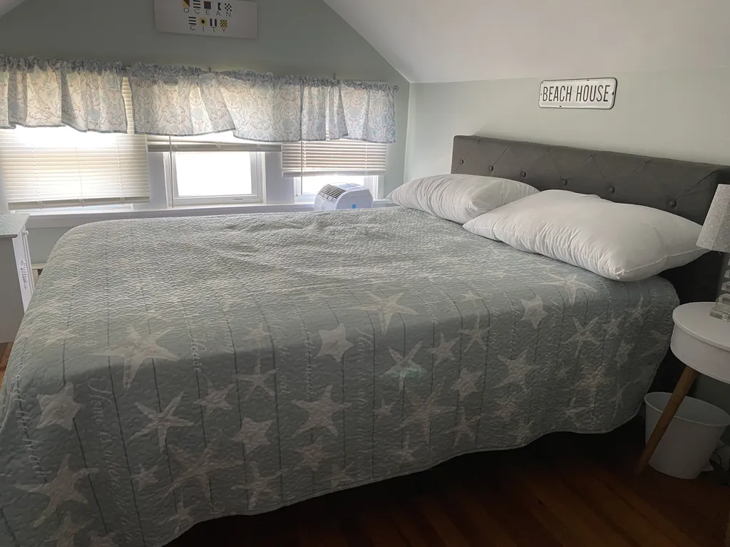 Larger bedroom with a queen bed.