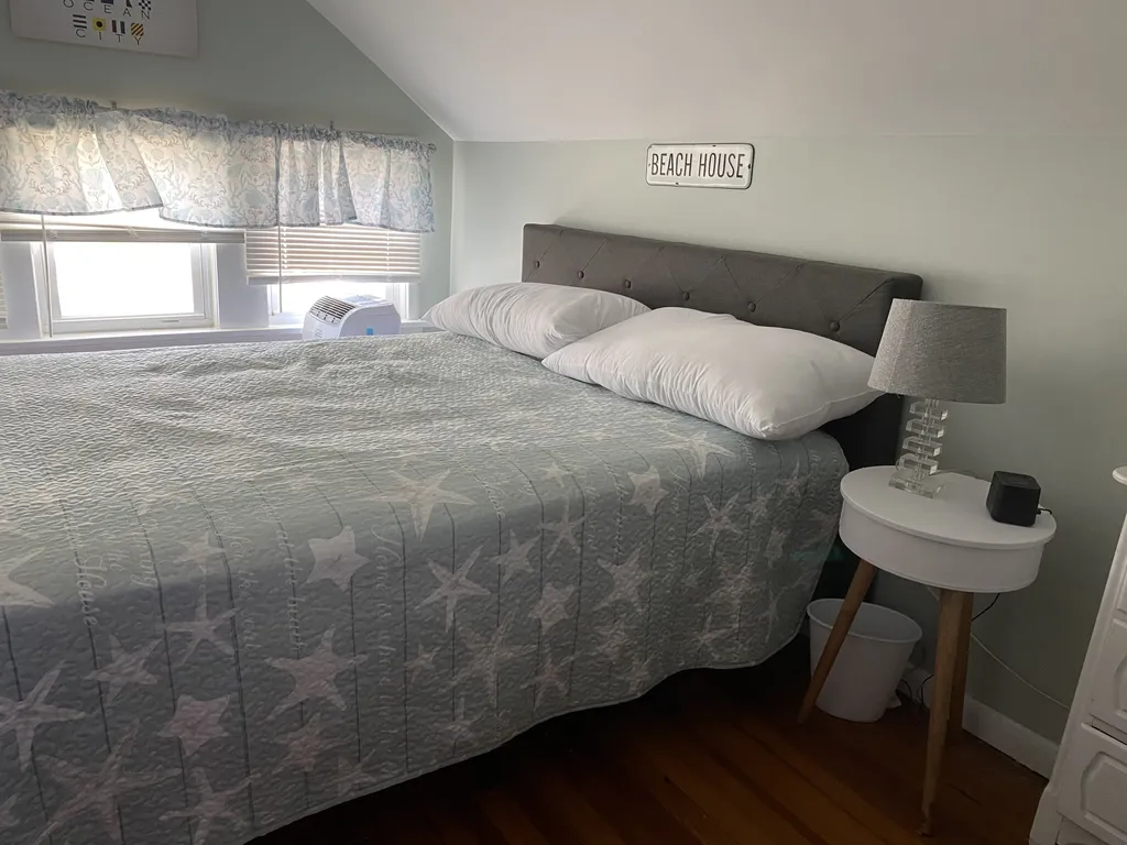 Larger bedroom with a queen bed.