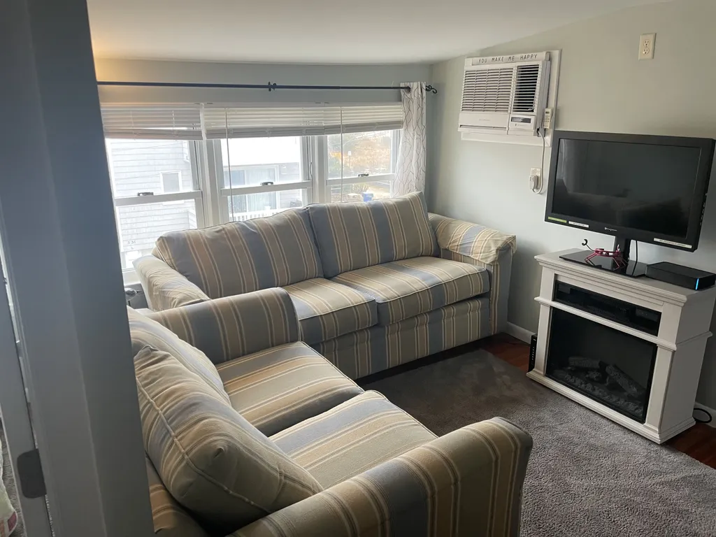 Living room with ocean views, fireplace and cable tv.