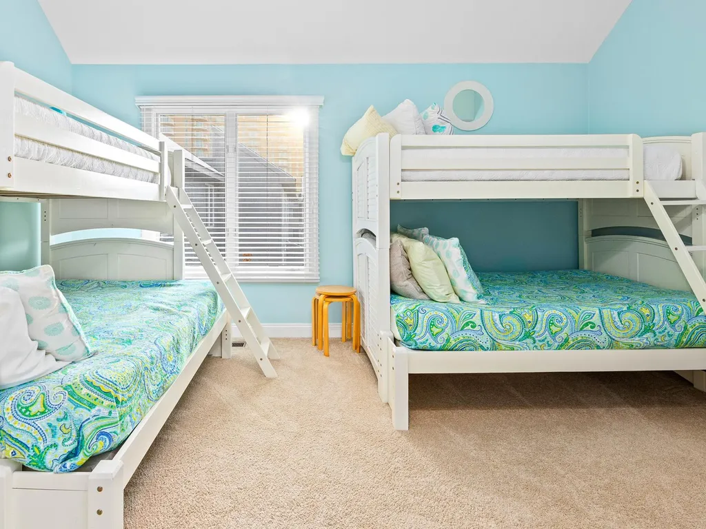 Bunk room with 2 twin over full bunks and private bathroom on top level