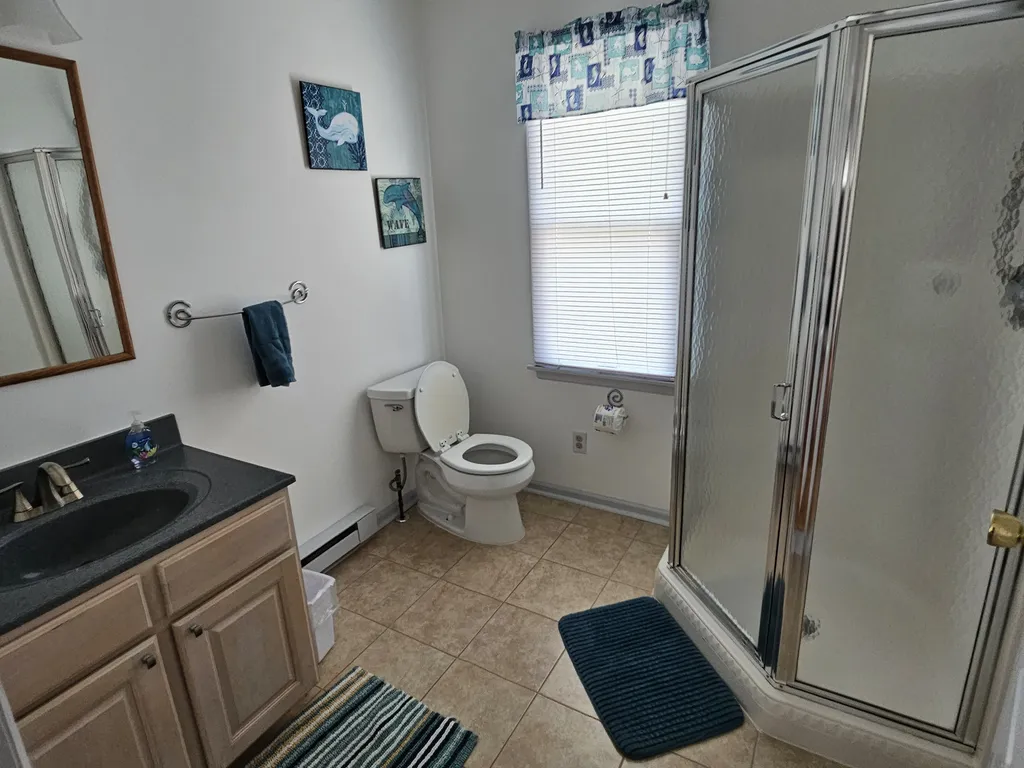 2nd fl. ensuite bathroom (connected to bedroom with queen bed)