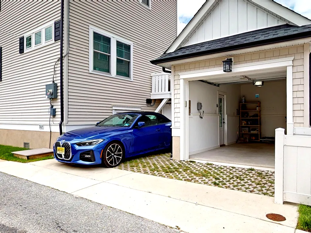 1 uncovered  off street parking spot. Small garage for bikes/beach gear
