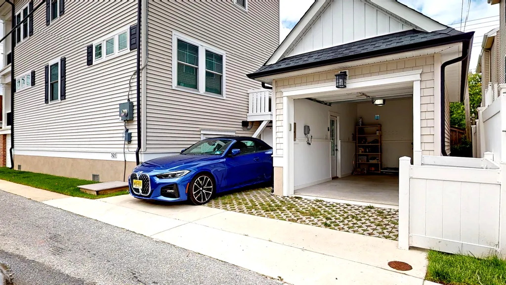 1 uncovered  off street parking spot. Small garage for bikes/beach gear