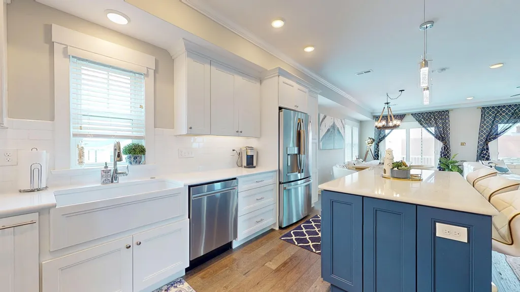 Gourmet kitchen with dishwasher, stove, fridge, bar fridge, oven