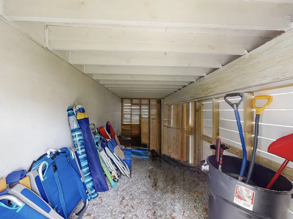Dry storage area for beach chairs (12 provided) and beach cart