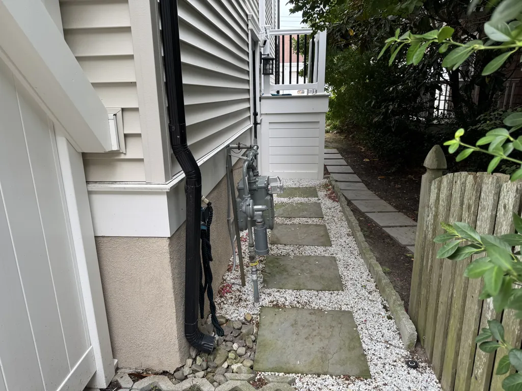 The path to elevator door is paved with stone at street level and may be uneven for wheelchair users.