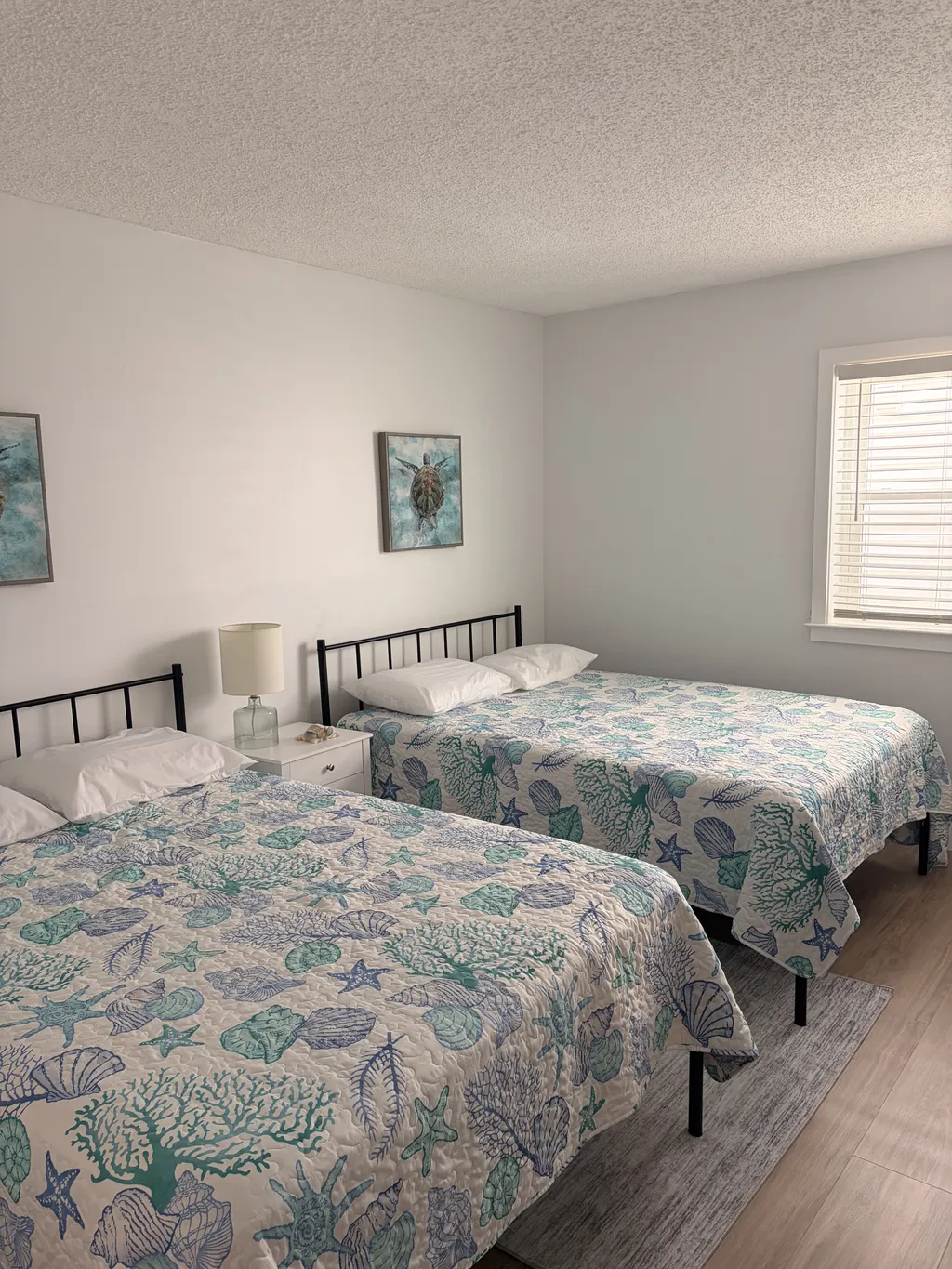 Bedroom two with two full beds.