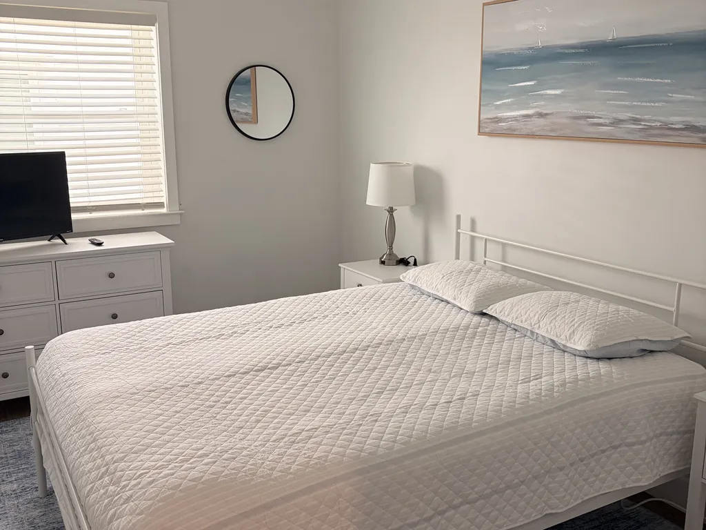 Bedroom one with queen bed