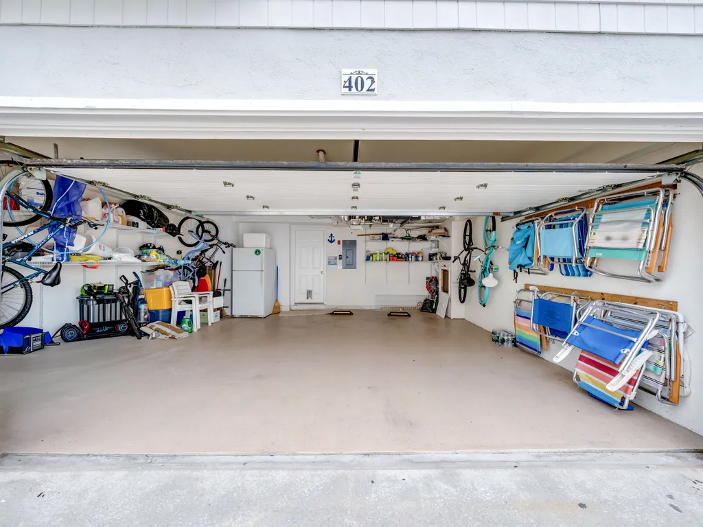 Large 2 Car Garage with Beach Chairs and Beach Umbrella